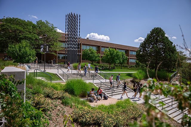 UCCS students on stairs by Engingeering Building