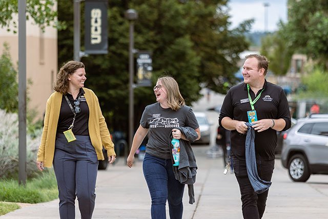 UCCS staff laughing on campus
