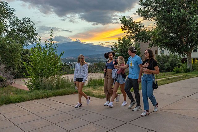 UCCS students walking on campus at sunset