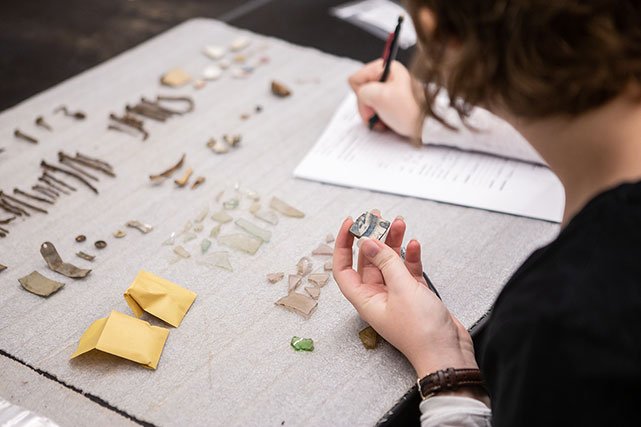 UCCS Anthropology student taking notes