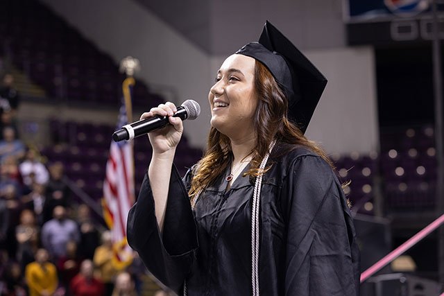 UCCS graduate singing at Commencement