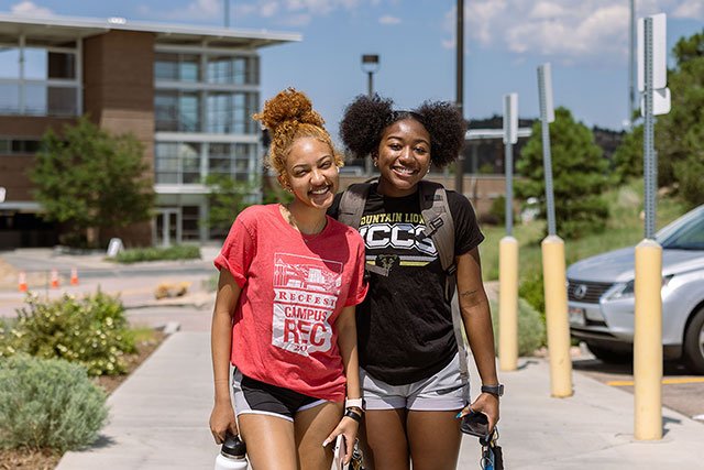 UCCS students smiling on campus