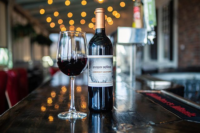 Bourbon Brothers branded wine on bartop