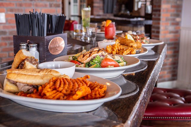 Bourbon Brothers multiple entrees on bar top