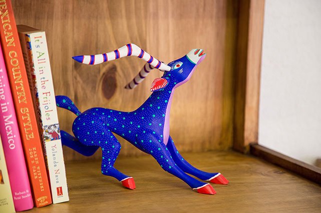 La Fuente Imports antelop-like animal sculpture on shelf