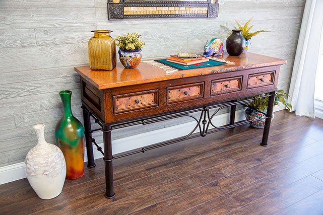 La Fuente Imports copper TV table with pots next to it