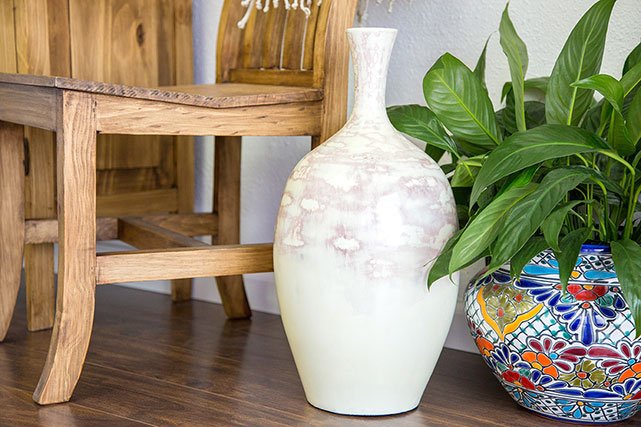 La Fuente Imports planters next to wooden chair