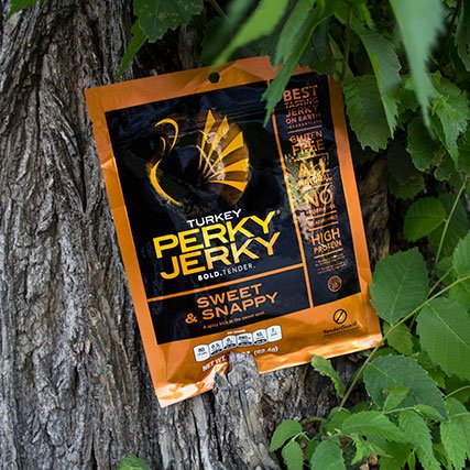 Perky Jerky in front of tree