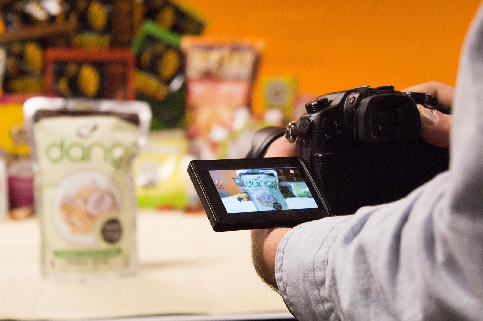 Person holding camera taking photos for Perky Jerky